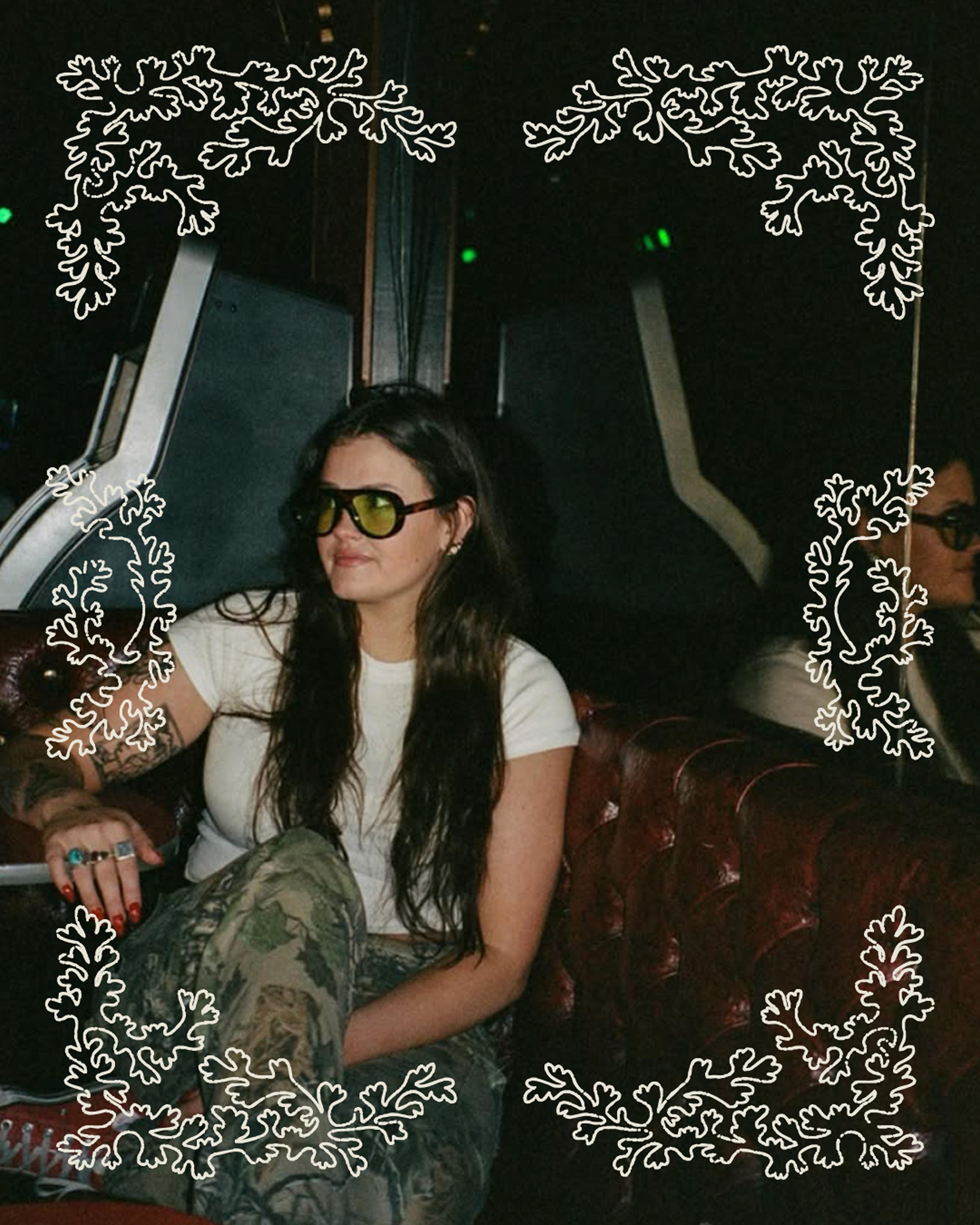 portrait of Corner Booth founder Makenzie McBride, framed by a floral design