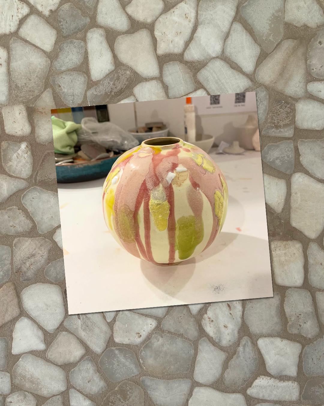 An Instagram graphic showcasing a student's pottery work: a playful vase drenched in different colours