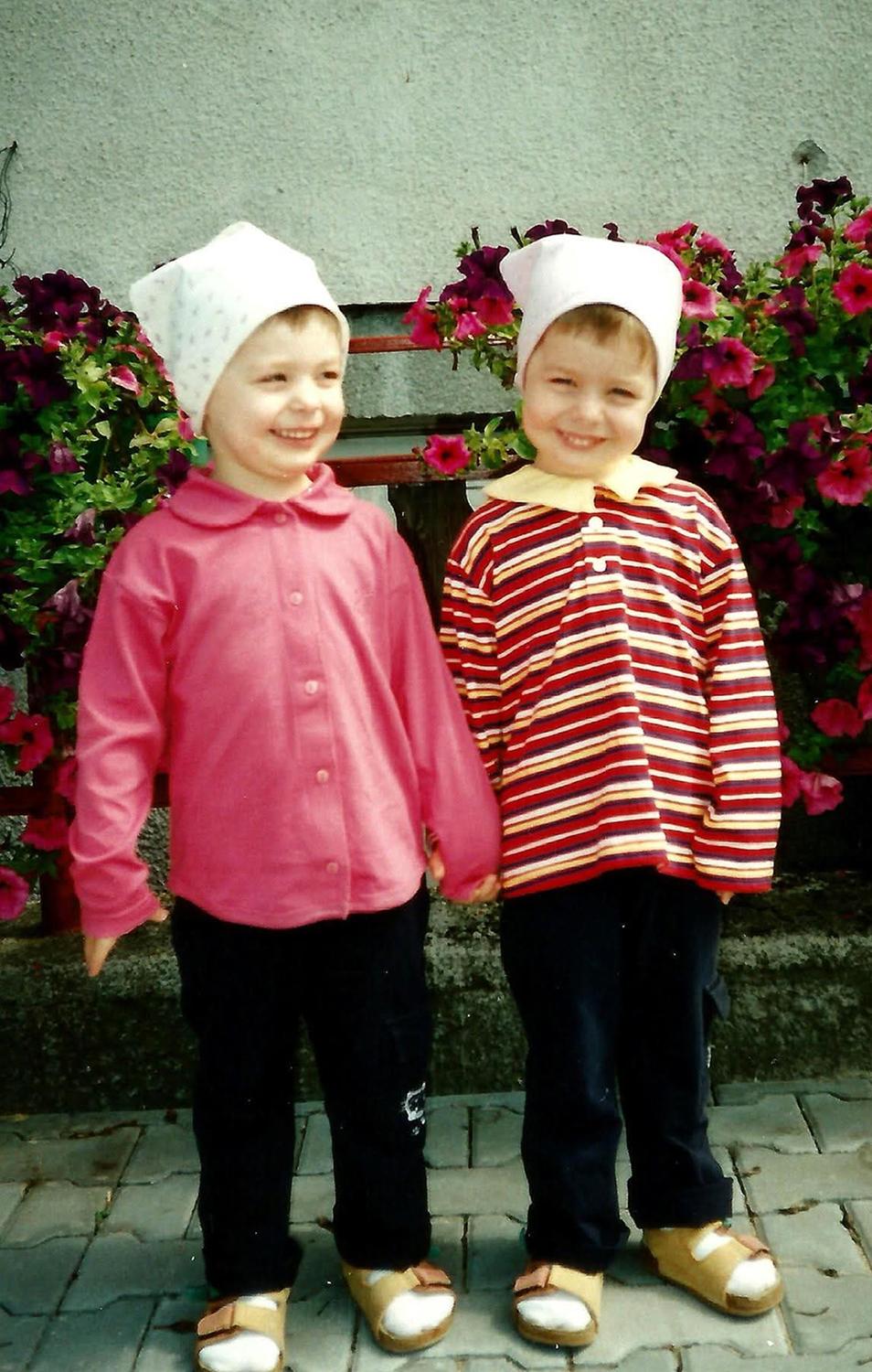 Identical twins holding hands, taken in the early 2000s